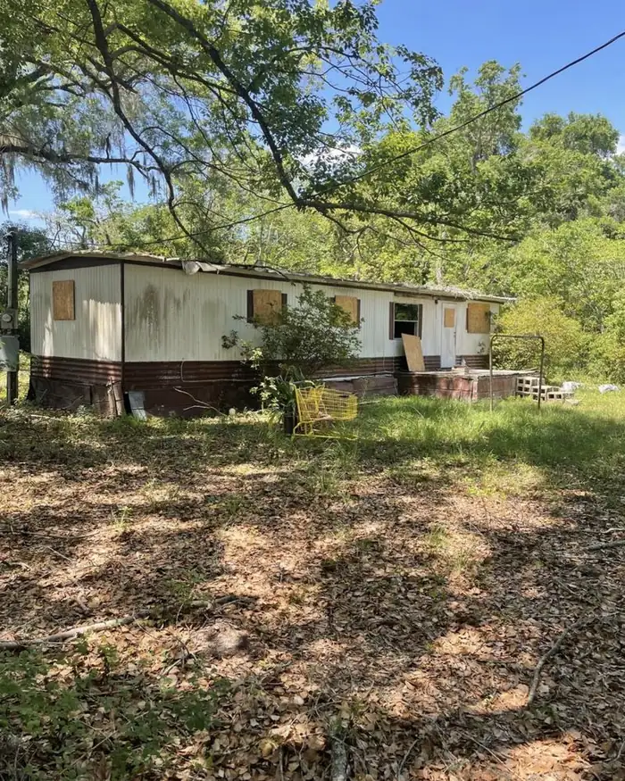 Boarded-up manufactured home sitting vacant