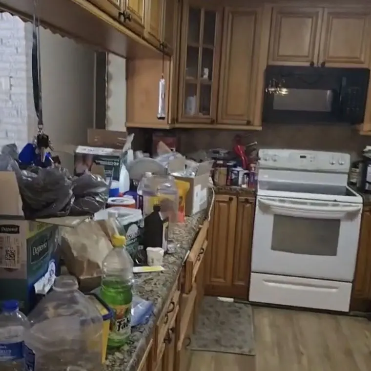 Kitchen counters covered in belongings left behind